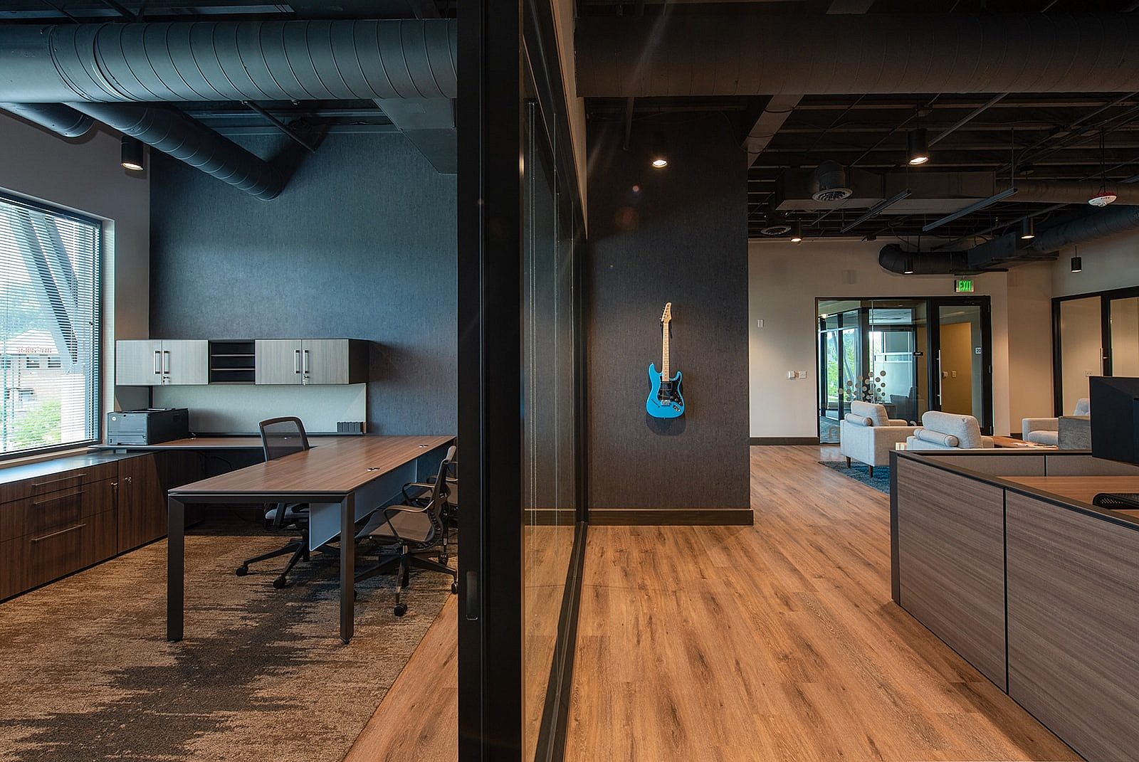 Half and half view of work station and reception desk and area